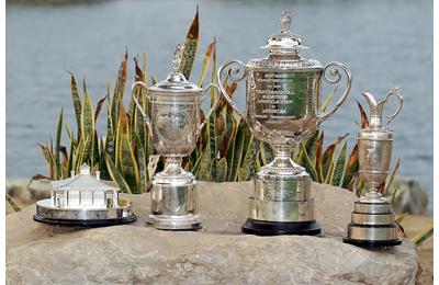 Golf's four men's major trophies.