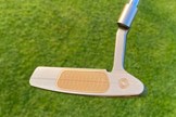 The gold face of the Odyssey Ai-One Silver Milled Two T CH putter is extremeley eye-catching