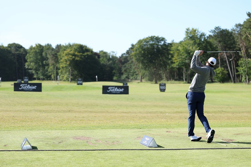 Scottie Scheffler makes the most of his time on the driving range.